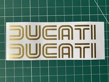 2x Ducati motorcycle gold logo
