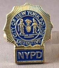 Police detective pin badge. Gold coloured lapel pin. USA law enforcer
