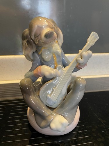 Lladro dog playing guitar - ,