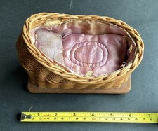 Antique wicker doll's cradle