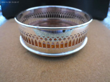 Vintage Large Pierced Silver Plate & Wood Wine Bottle Coaster: 4.75" diameter.