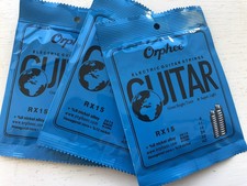 3 sets orphee guitar strings plus 10 picks/string winder pick holder