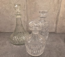 Three vintage cut glass decanters