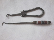 Vintage folding button hook and one other