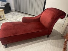This is a red velvet chaise