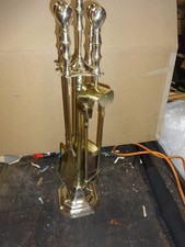 A Large Brass Fireside Companion Set