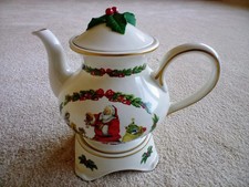 Fine Porcelain Christmas Teapot and Stand by The Franklin Mint Copyright 1991.