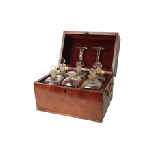 Antique mahogany tantalus with six cut-glass decanters and glasses, ca. 1790