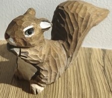 Hand carved squirrel - hand,