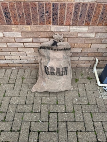 Rustic hessian grain sack with - grain,