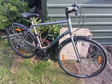 Kona Dew Hybrid Bike With a 21 inch frame.   Great Condition.
