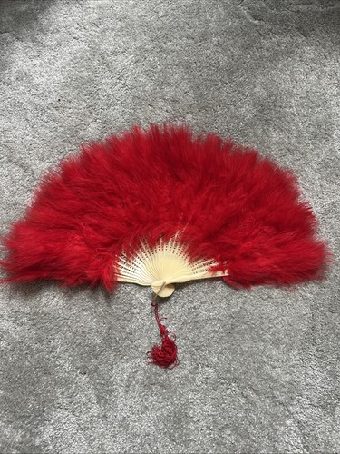 Brand new red feather hand - new,