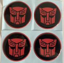 ALLOY WHEEL CENTRE CAP STICKER DOME RESIN X4 TRANSFORMER BLACK RED AUTOBOT 65mm