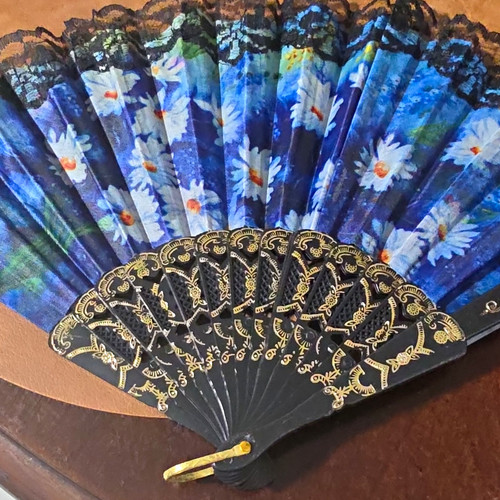 Women folding hand fan - folding,