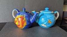 Pair ceramic teapots - of,