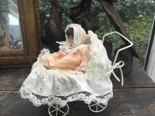 Porcelain face doll pram - face,