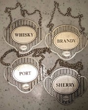 Hallmarked pierced sterling silver decanter label set.