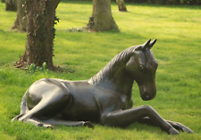 foal laying garden ornament / laying horse sculpture