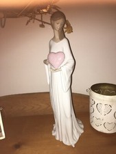lladro figurine girl with heart