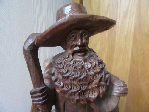 Carving man with - carving, a