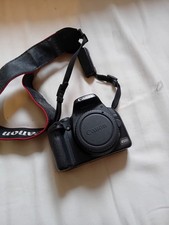 Canon EOS 450D with two lenses, bag, and accessories. 