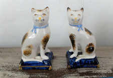 A pair of antique small ceramic Staffordshire cats - circa 1860