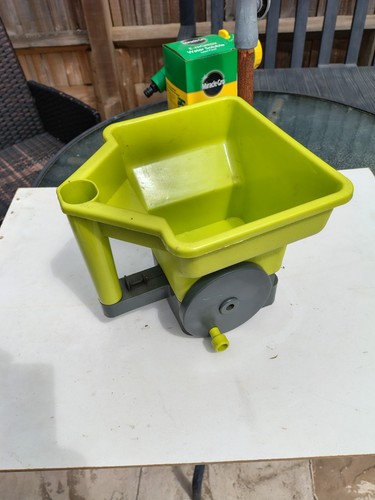 Hand held lawn seed - hand,