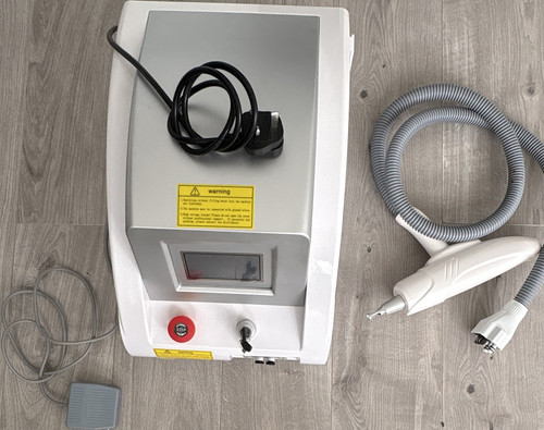 Laser tattoo removal device - tattoo,