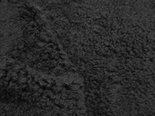 Black short curly hair on soft