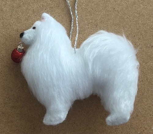 Samoyed holding red - samoyed,