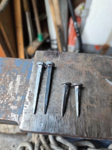 Rose head hand forged nails - head,