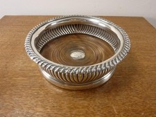 A nice Antique Wine champagne Bottle Coaster silver plated wooden base