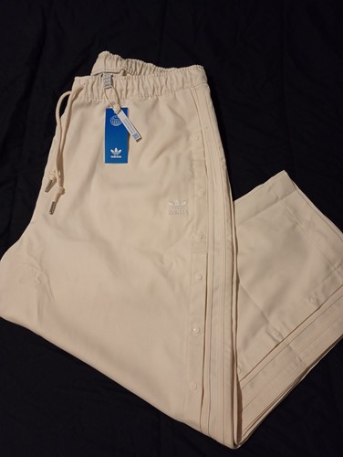 Adidas popper style trousers