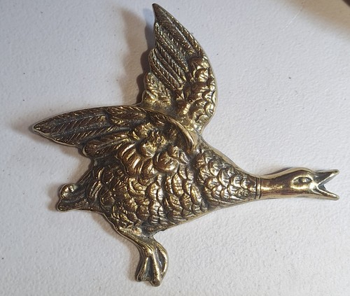 Cast brass flying duck wall - cast,