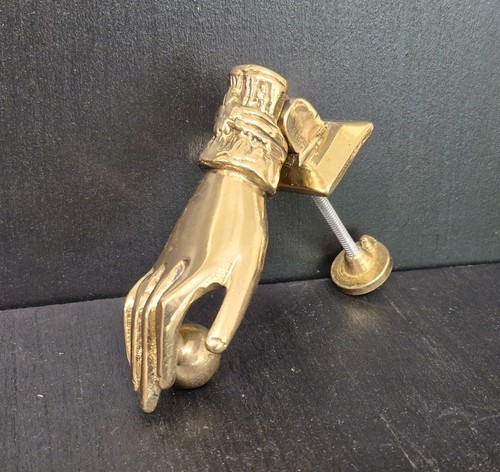 Brass door knocker - hand, and