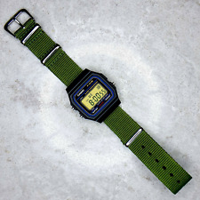 Casio F-91W Watch on a Green