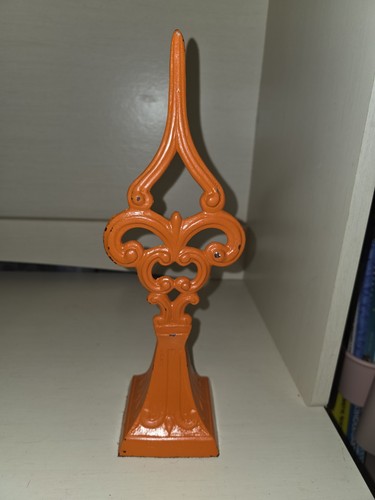 Orange cast iron fence post - cast,