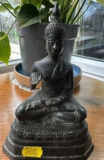 A chinese buddha bronze figure