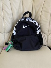 Nike Brasilia JDI Kids' Mini Backpack in a black and white graphic colorway.