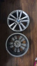 BMW series 1/2 rims. Grey colour with wheel caps. Never been used