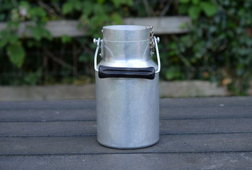 Vintage old aluminium milk