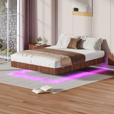 Bed frame A large floating bed frame made of walnut wood with LED lights
