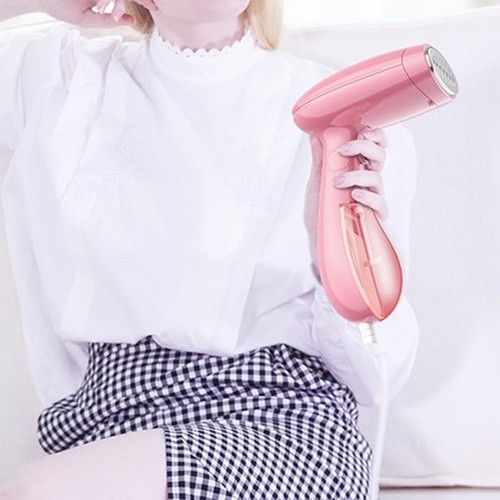 Clothes iron hand holding - clothes,