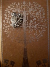 A Silver Tone  Owl On A Branch