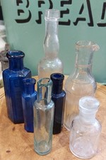 Selection Of Antique And Vintage Bottles, Including Poison ? Blue Ribbed Glass.