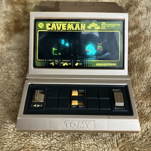 Grandstand caveman handheld - grandstand,
