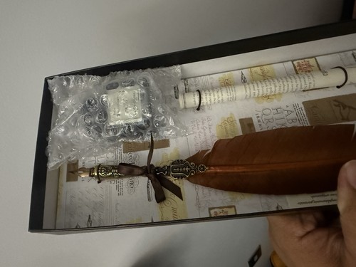 Brown pewter feather quill and - feather,