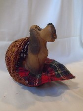 HOUND DOG CERAMIC FIGURINE WITH BASKET