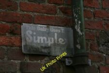 Photo 6x4 Dairy equipment advertising plate on farm building in South Kel c2015