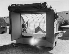 Woman in Outdoor Tanning Booth